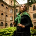 a woman standing in front of a building